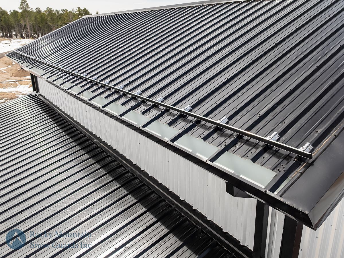 Colorgard snow bar installed on metal roof